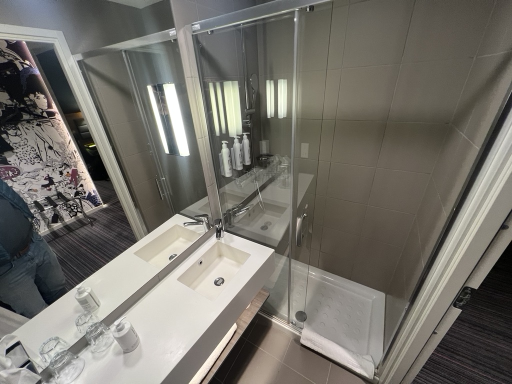 4D7947BD-0630-4184-9E96-47DD19D48A2E_1_105_c bathroom wide angle image showing shower and basin