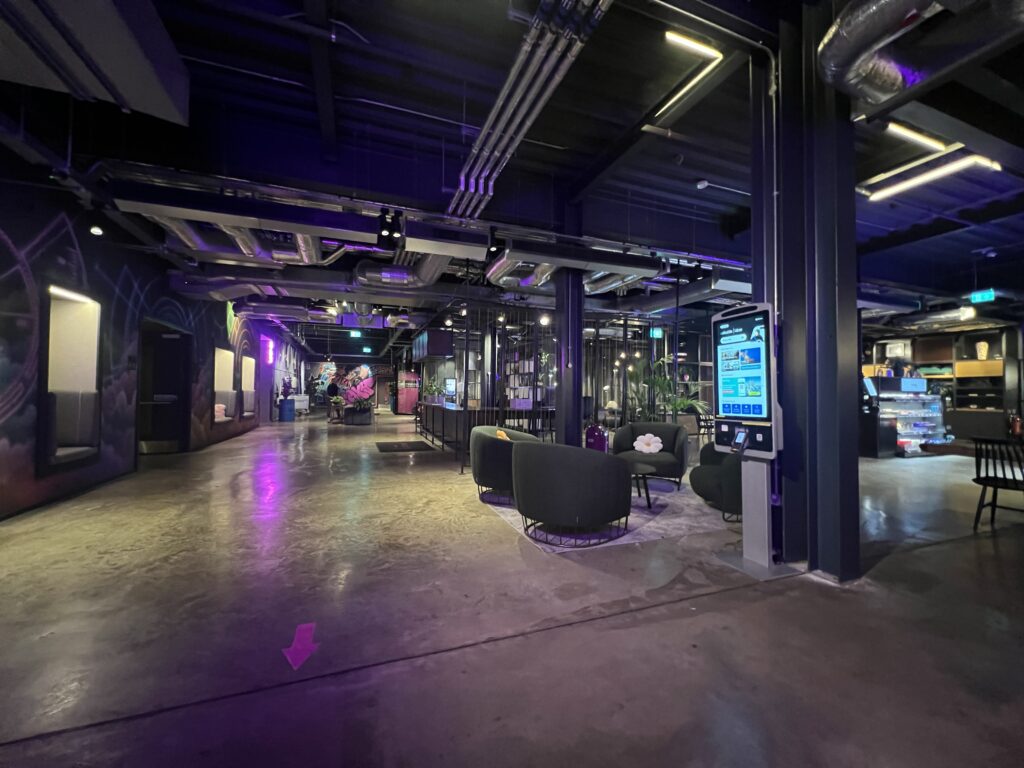 interior night photo of the moxy london heathrow lobby